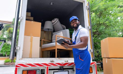Delivery house move cargo truck service man checking box list from digital tablet for signature